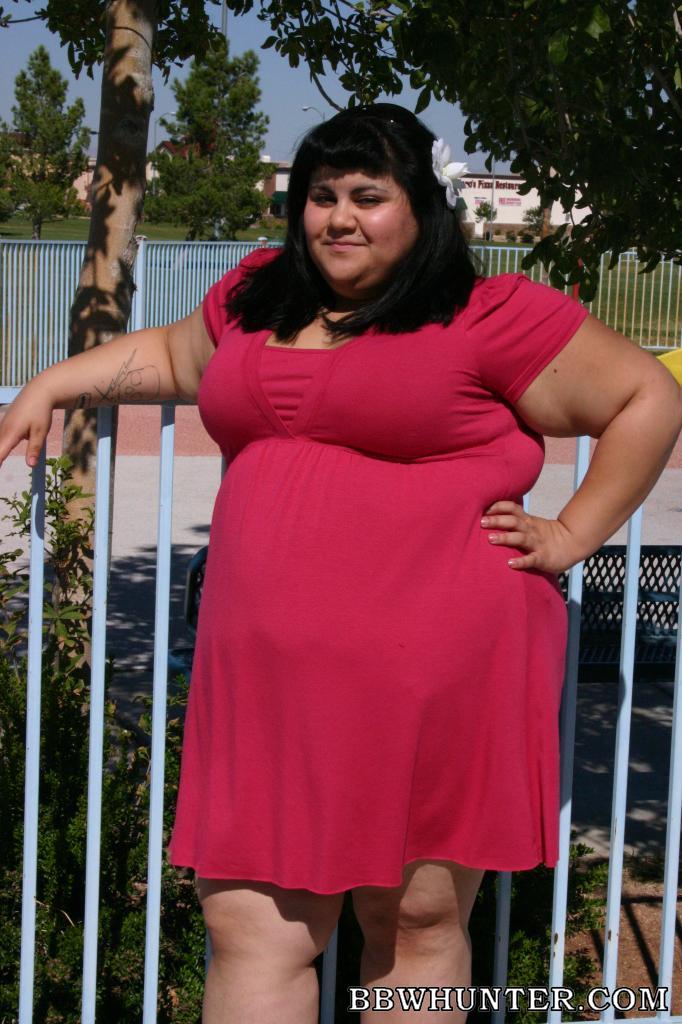 Ursula BBW in red dress at park